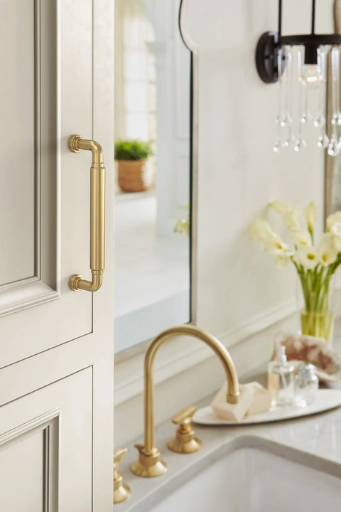 Coble Transitional Champagne Bronze Cabinet Pull 5-5/8 Inch Overall Length with 5-1/16 Inch Center-to-Center Mounted on Beige Cabinet