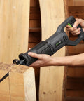 Heavy Duty Corded Reciprocating Saw 120V With 6.0 Amp Motor And 2800 RPM cutting through wooden beam at worksite.