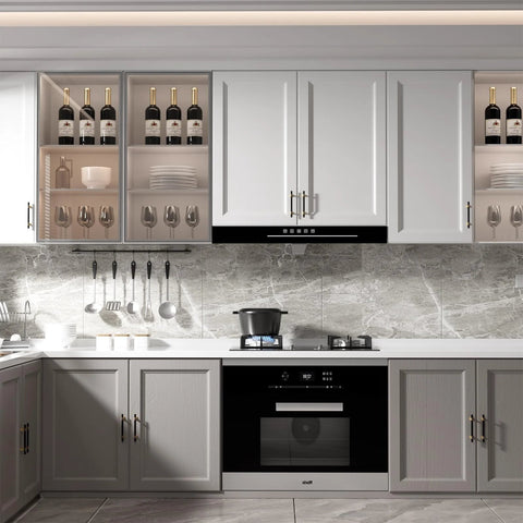 Modern kitchen with 10 Pack 3 Inch Hole Center Cabinet Handles In Black And Gold Matte Finish installed on white and gray cabinets.
