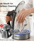 Person cleaning Fast Boil Electric Water Kettle 1.8L With Auto Shut Off Boil Dry Protection BPA Free Borosilicate Glass And Stainless Steel