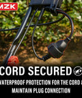 Close-up of cord connection on 15-Inch 2-In-1 Electric Dethatcher And Scarifier with waterproof protection in a garden setting.