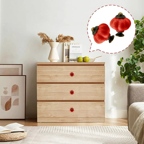 Set Of Eight Red Ceramic Pumpkin Knobs With Heavy Duty Zinc Base And Shiny Embossed Glaze For Vintage Cabinets And Kitchen Drawers on dresser.