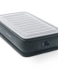 Super Thick Twin Air Mattress With Built In Pump And Roll Up Travel Bag Featuring Rock Solid Dual Layer Support And A Cozy Velvet Surface for camping.