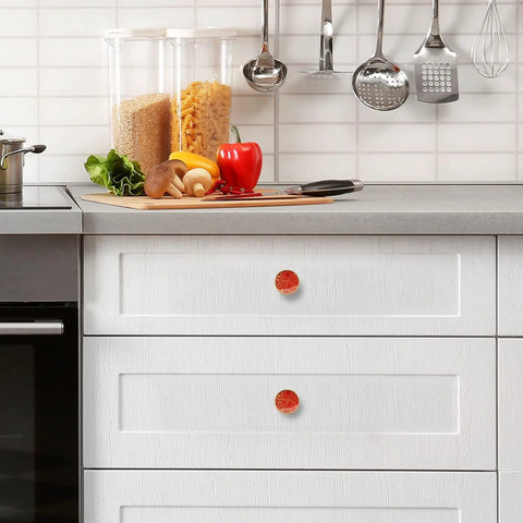 Top Shelf Red Happiness Round Cabinet Knobs Featuring A Slick Vintage Oil Paint Finish Hella Sturdy Rust Resistant Zinc Alloy Drawer Pulls Single Hole Mount Center Pack Of Four For Kitchen And Bedroom Cabinets on a white kitchen drawer.