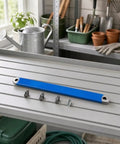 Badass Offset Extension Wrench With Swappable Drive Adapters And Quick Socket Attachments Built From Tough High Carbon Steel No Hustle Multi Tool For Cramped Spaces Or Gunked Up Bolts Orange on a shelf with tools and pots.