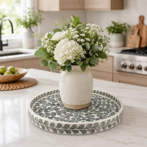 Game Changing 12.5 Inch Wooden Lazy Susan Turntable With A Smooth Swivel Base Sharp Black Leaf Design And Authentic Mother Of Pearl Inlay showcasing a vase with flowers.