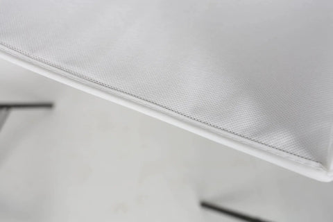 Close-up view of the clean white non woven fabric on the Rock Solid Six Shelf Hanging Closet Organizer with dividers.