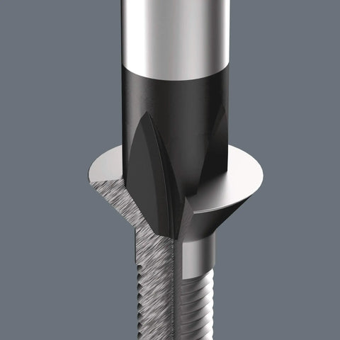 Close-up of a metallic tool component, with sharp edges and detailed grooves, related to precision mechanics or machining processes.