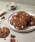 Plate of chocolate chip cookies baked on a Nonstick Silicone Baking Mat For Cookies, Pro Grade Quality With Fiberglass Mesh.
