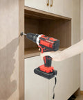 No Fuss Cordless Drill Set Heavy Lifter Handheld Power Tool With All Day Battery Pack Ready To Roll For Tough Tasks Without Overheating Problems In Sleek Red Finish, drilling into cabinet.