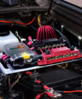High Current Power Distribution Block Bus Bar For 48 Volt Systems, Four Five Sixteenths Inch Posts, Six Number Eight Screws, installed in engine