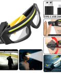Game Changer Durable Rechargeable Headlamp Glasses With Smart Motion Sensor And Quick Tap Controls For Camping Hiking Fishing And Outdoor Adventures Two Pack Yellow Lenses close-up view with USB charging port and motion sensor features.