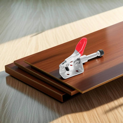 Horizontal Push Pull Toggle Clamps Quick Release Welding Table Clamps, heavy-duty iron and PVC with red handle on wood surface