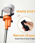 Zero Sweat Electric Smoke Detector Swap Tool Featuring Radio Controlled Expandable Silicone Grips and Adjustable Telescoping Handle for Ceiling Mounted Fire Safety Device Replacement in action with remote and ceiling unit.