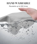 Navona microfiber glasses cleaning cloth, gray, handheld with water splash (front view)
