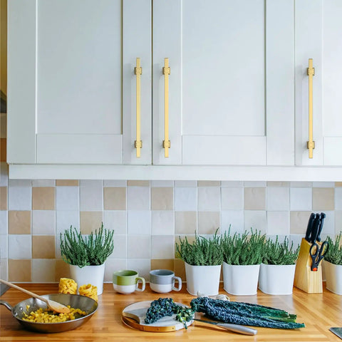 Boss Level 10 Inch Brushed Gold Kitchen Cabinet Handles 10 Pack on modern cabinets in a kitchen with countertop herbs.