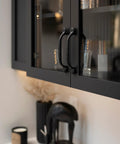 Solid Core Kitchen Cabinet Pulls Pack Of 10 In Black Iron For Doors And Dresser Drawers Luxury Hardware With Three Quarters Of An Inch Hole Center Heavy Duty Black Rustic Style From Refined Rustic Collection displayed on cabinet doors.
