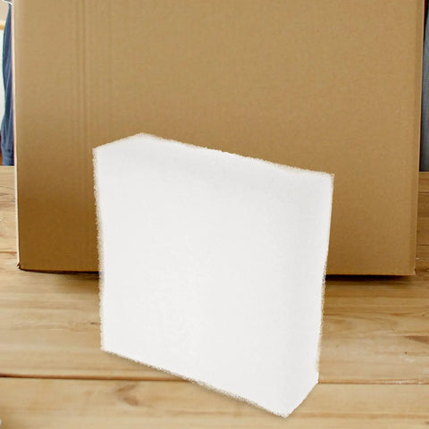 Rock Solid White Eva Foam Board two piece flexible packing insert in front of a cardboard box for safe shipping and craft work.