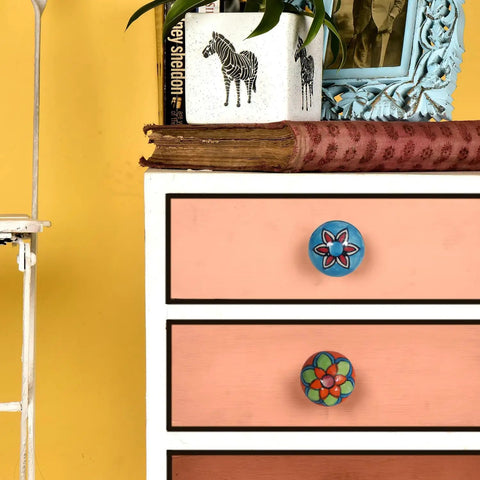 Colorful Ceramic Drawer Knobs on dresser, showcasing floral designs. Snag These Dope Colorful Ceramic Drawer Knobs And Boho Cupboard Pulls To Quick Flip Your Kitchen Cabinets Or Dressers A Total Vibe Upgrade For Any Room Comes In A Twenty Piece Set.