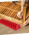 Red 12 Piece Plastic Wrench Storage Organizer Tray next to a person assembling wooden furniture