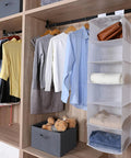 Rock Solid Six Shelf Hanging Closet Organizer With Dividers In Clean White Non Woven Fabric, storing clothes on shelves.