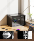 Heavy Duty 20 Lb Biometric Safe With Rock Solid Fingerprint Lock And Bright LED Light Featuring Built Tough Heavy Gauge Construction on desk.