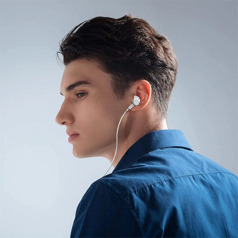 Man wearing Two Pack USB C Earbuds With Mic And Remote, Noise Cancelling Wired Headphones For iPhone 15 Series