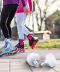 Quad Skate Toe Stoppers Set With Adjustable Height Brake And 82A Rubber for beginners, shown in use on outdoor skates.