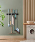 Wall Mount Mop And Broom Holder With Four Slots And Four Hooks For Quick Easy Gear Organization In Pantry Closet And Laundry Room