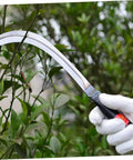 Person using 13 Inch Scythe Mowing Knife With Sharp Rustproof Steel Blade For Gardening Weeding And Lawn Care With A Top Notch Grip