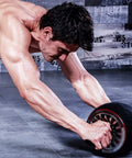 Automatic Rebound Ab Wheel Core Strengthener Featuring Silent Multi Angle Rollers And Ergonomic Handle Grips To Build Chiseled Abs At Home Effortlessly Boost Your Flex And Crush Your Daily Gains in use by a muscular man.