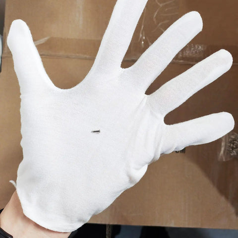 Tiny Carbon Steel Nails 1.2X6Mm Miniature Wood Fasteners Nickel Plated Heavy Duty in white glove for clear handling.