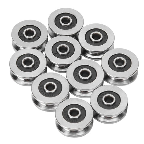 Rock Solid V Groove Track Roller Bearings TV0418 10 Pack 4x18x8mm steel guide rail bearings in a cluster.