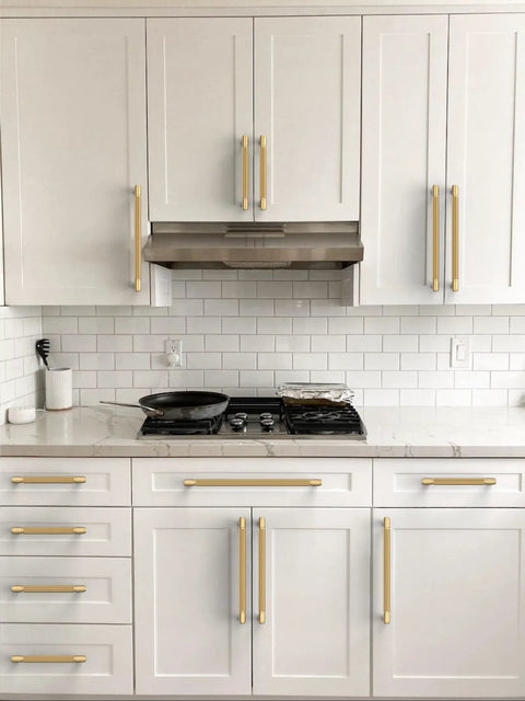Ten Pack Champagne Bronze Knurled Cabinet Pulls 5 Inch Center To Center Kitchen Drawer Handles on white cabinets in modern kitchen.