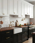 25 Pack Antique Brass Cabinet Pulls Made From Rock Solid Zinc Alloy feature smooth gliding in a stylish kitchen with white and black cabinets.