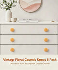 Set Of Six Bright Yellow Ceramic Cabinet Knobs Featuring Classic Floral Handles That Are Hella Durable And Ready For Zero Drama Cleanup This Total Kitchen Game Changer Adds Sweet Vintage Vibes To Any Drawer Or Cupboard Upgrade on white dresser.