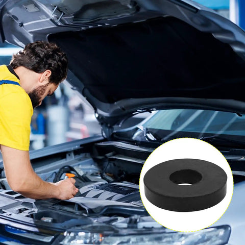 Heavy Duty Rubber Spacers And Anti Vibration Pads 16 Pack Badass Bolt Cushions For Auto Rigs Boats And Home Systems Durable black shock isolator in front of mechanic working on car engine.