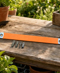Badass Offset Extension Wrench With Swappable Drive Adapters And Quick Socket Attachments Built From Tough High Carbon Steel No Hustle Multi Tool For Cramped Spaces Or Gunked Up Bolts Orange, with a 39 cm handle and interchangeable drives on a wooden surface.