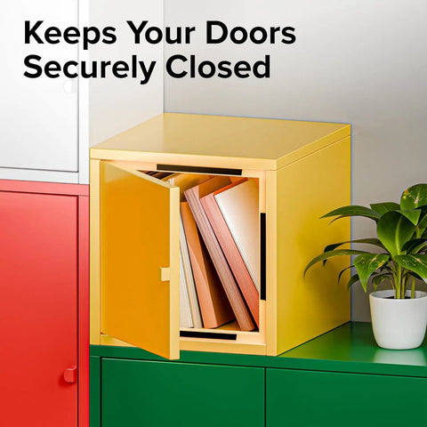 Yellow cabinet with door open displaying books, demonstrating magnetic tape with adhesive backing; plant beside for decor.