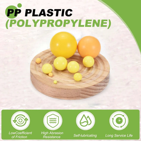 Hardcore 100 Piece Polypropylene Plastic Bearing Balls 5/32 Inch 3.94 mm Yellow G2 on wooden surface showcasing various sizes.