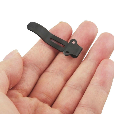 Knifemen Gonna Swear By This Badass 20 Piece Pocket Knife Upgrade Kit featuring a black deep carry clip held in a hand.