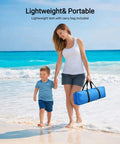 Woman and child walking on beach carrying Portable Beach Sun Shelter For Families And Groups, Grab And Go Easy Setup Cabana Tent in bag