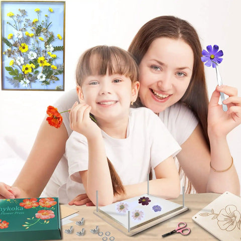 Mother and daughter using Pro Grade Eight Layer Flower Press Kit 6.3 By 8.3 Inch Wooden Flower Press with tools and pressed flowers