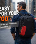 Badass Small Hard Shell Eva Zipper Case For Electronic Accessories Red Compact Travel Organizer Bag attached to backpack with carabiner.