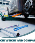 Heavy Duty Oil Drain Screw Removal Tool And 30mm Hexagonal Socket Wrench For Cars, blue tool on garage floor next to jack.