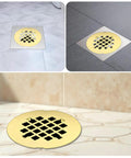 Rock Solid Gold Snap In Shower Drain Cover For Four Quarter Inch Round Stainless Steel Strainer on tiled bathroom floor.
