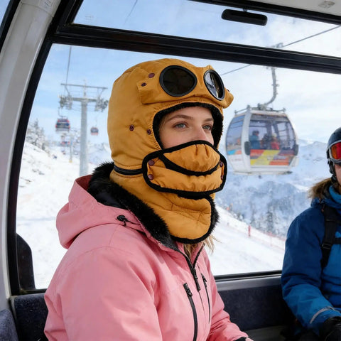 Person wearing Winter Hat With Thermal Barrier And Fleece Lining, Insulated Bonnet With Detachable Eye Shield, Bold Yellow, in ski lift.