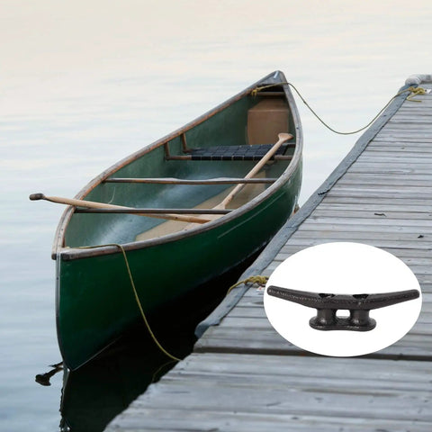 Heavy Duty 4 Inch Black Dock Cleats With Hardware 4 Pack for piers and decks shown securing a canoe to a wooden dock.