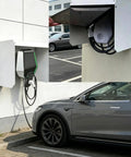 Heavy Duty EV Charger Protective Shell Outdoors With Bulletproof Galvanized Steel Housing mounted near an electric vehicle.