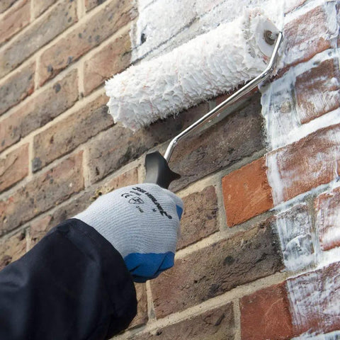 Applying One And A Half Gallon Clear Brick Sealer For Brick Stone Concrete And Masonry on brick wall with roller